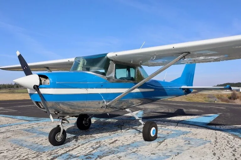 Cessna 150 aircraft parked at an airfield