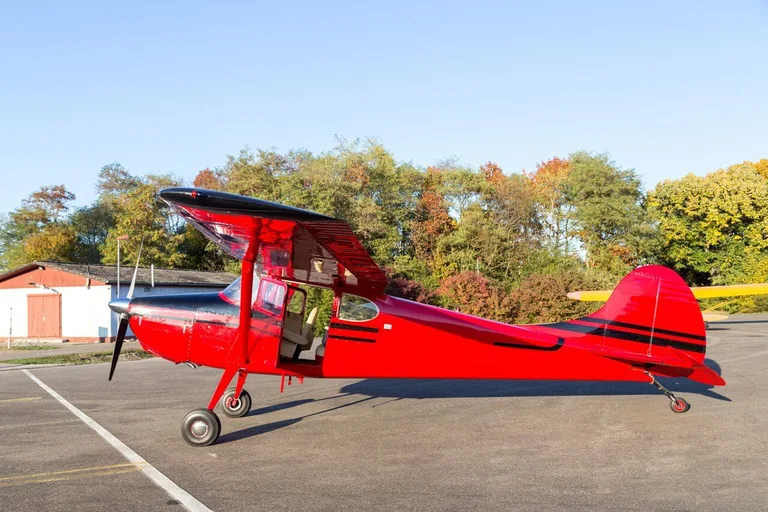 Cessna 170 parked on an airport apron