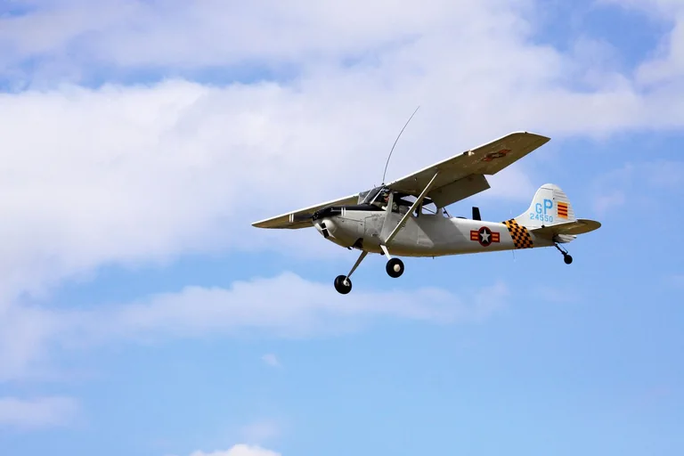 Cessna Bird Dog aircraft in flight