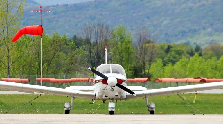 Piper Cherokee aircraft parked at an airfield