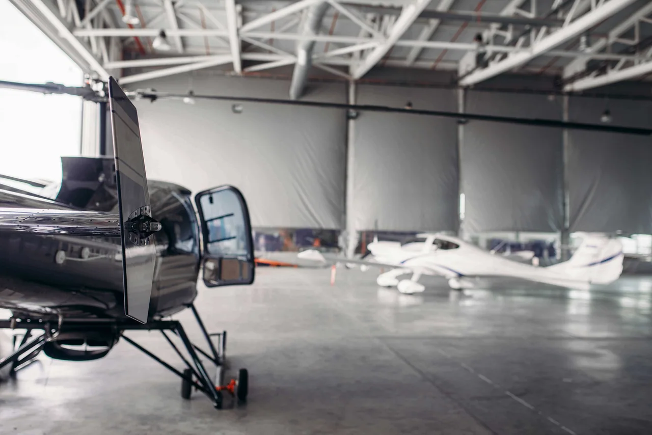 An aircraft inside a hangar