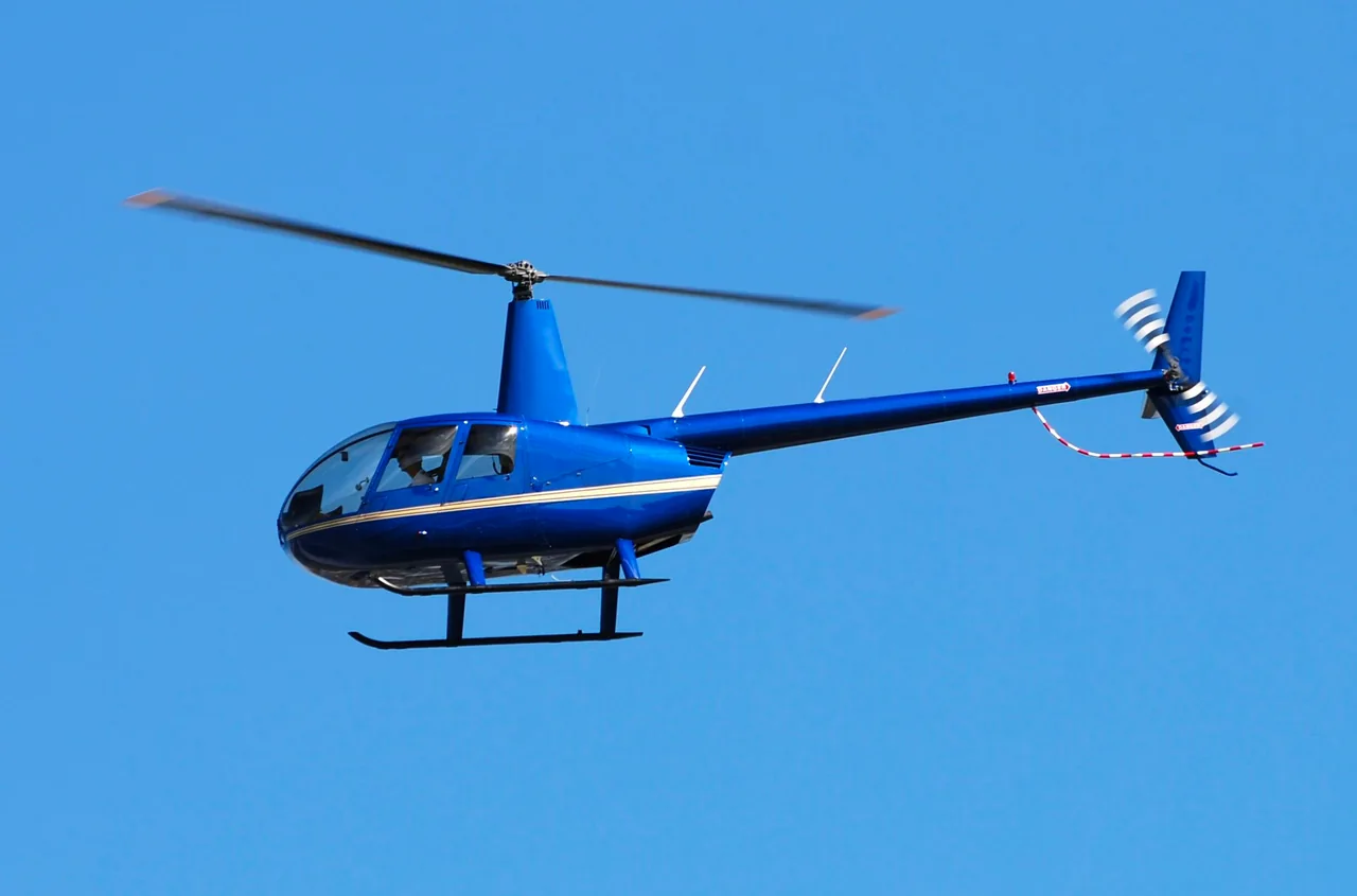 Robinson R44 helicopter in flight