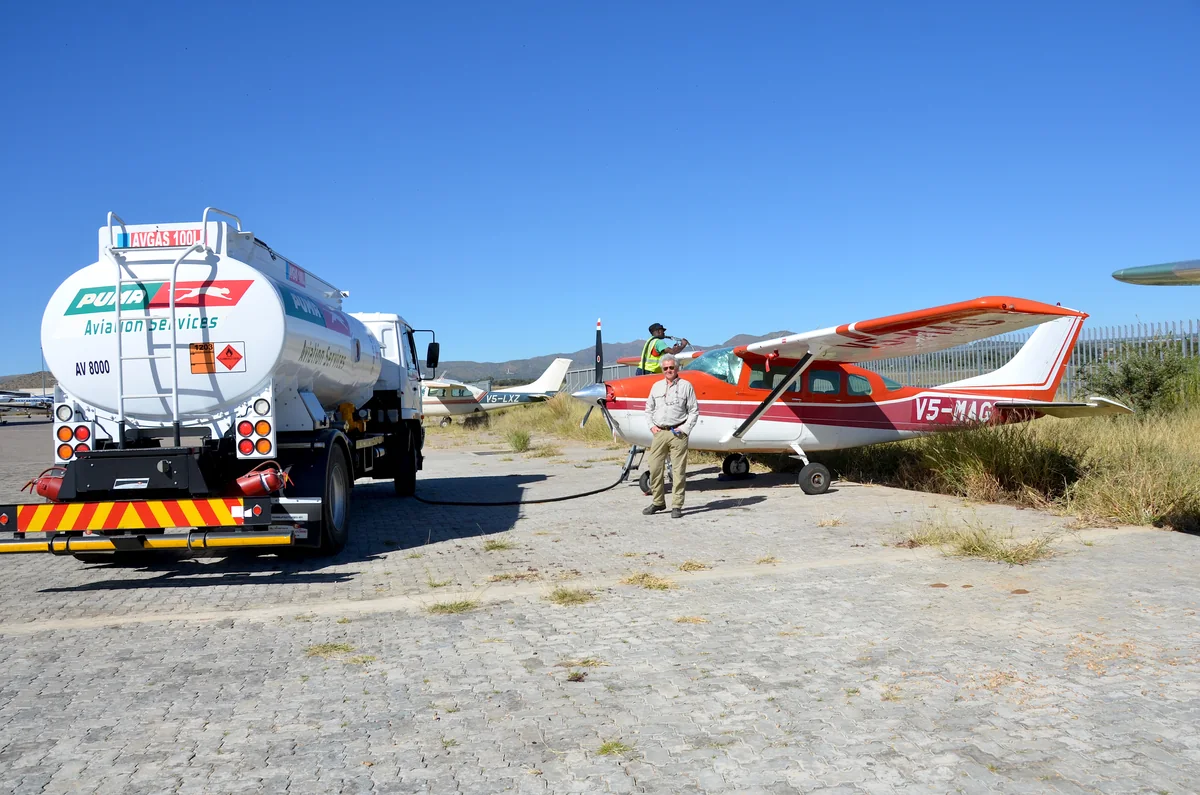 A general aviation aircraft beside a fuel truck at Eros Airport in Namibia