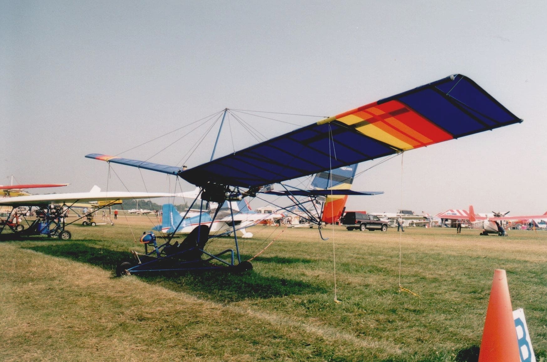 Single seat Quicksilver MX displayed on grass at Oshkosh in 2001