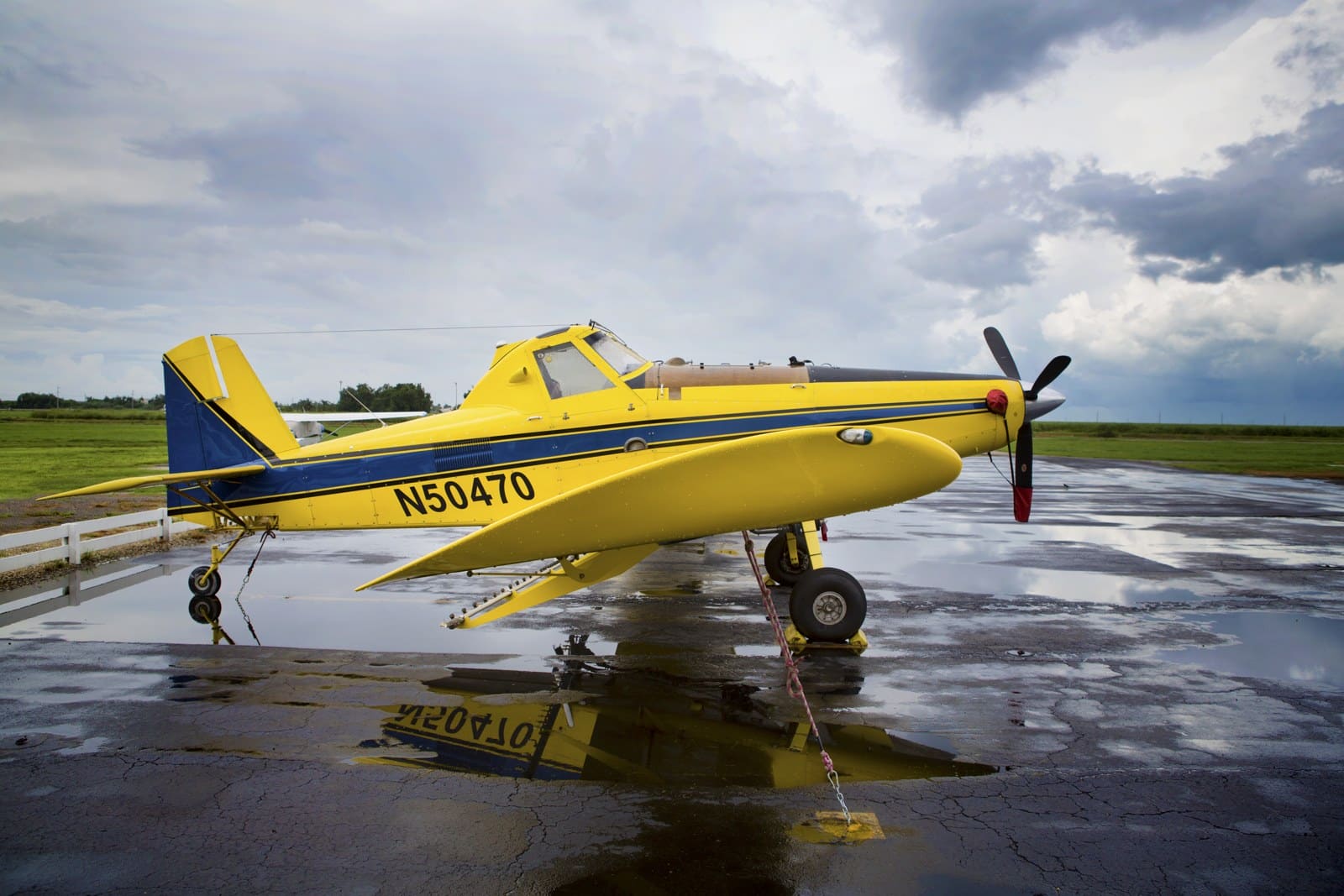 Yellow Air Tractor AT-502B agricultural airplane parked on an airport ramp