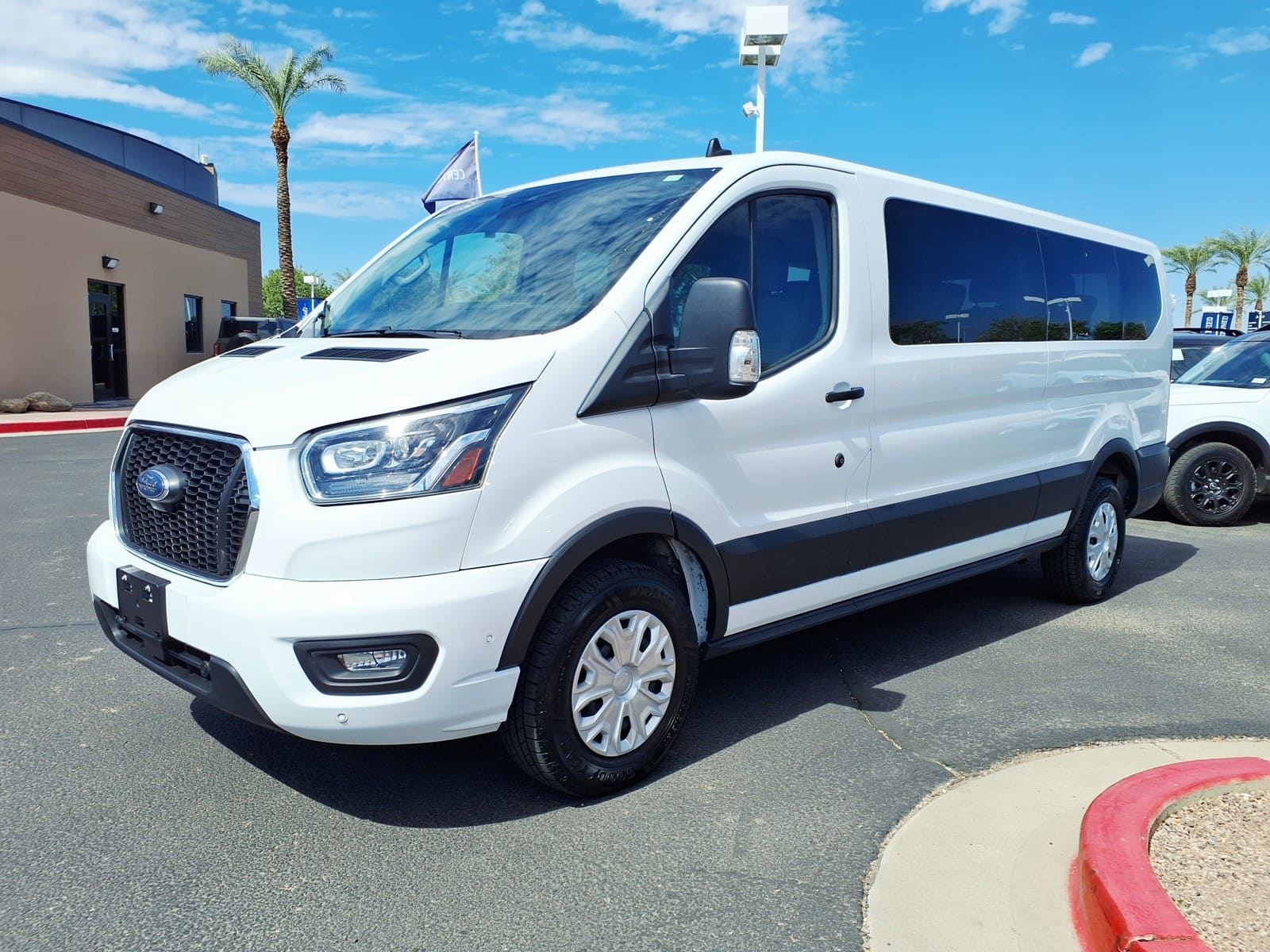 White Ford Transit 350 XLT van parked in Gilbert Arizona