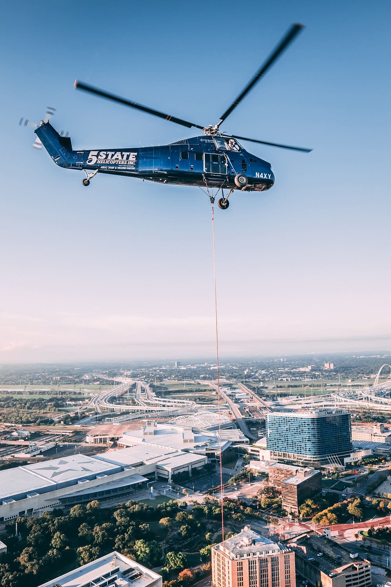 Sikorsky S58T helicopter N4XY with an external line during a lift operation