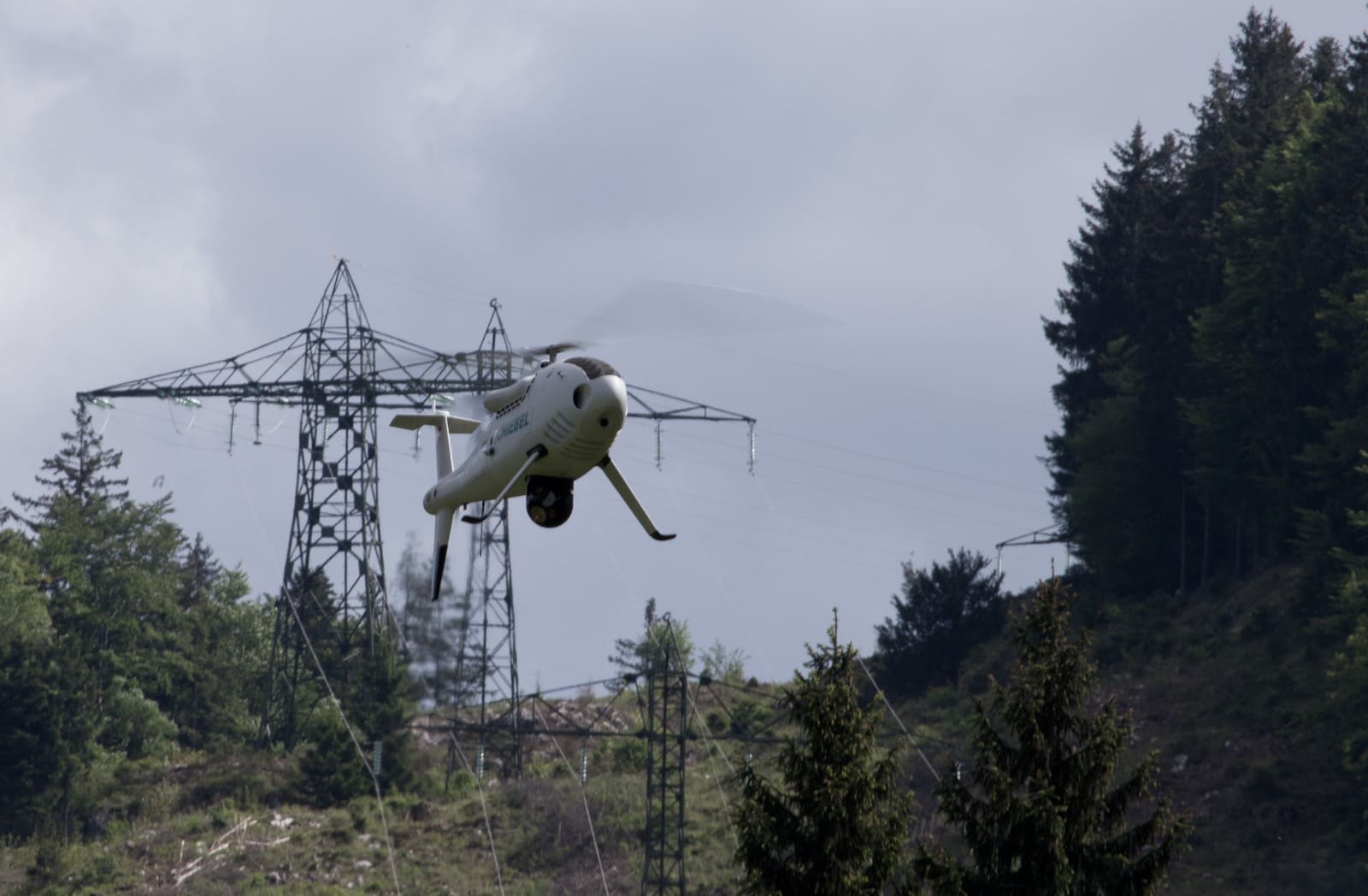 Unmanned helicopter near utility power lines in Austria