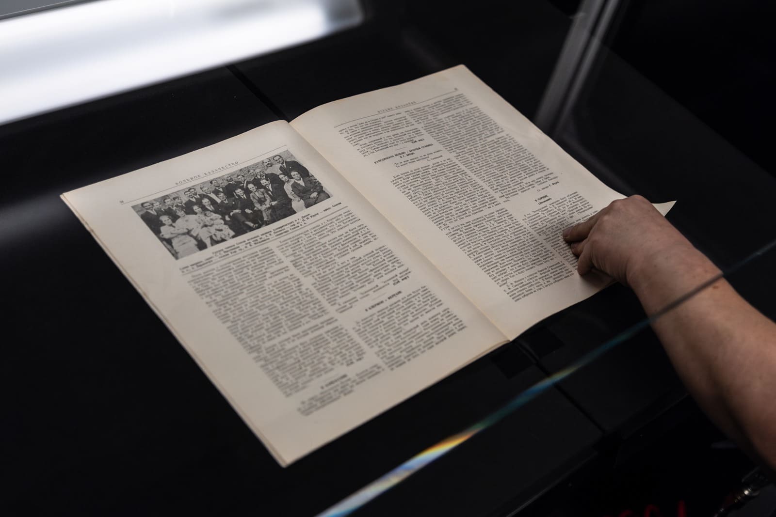 Manual book scanner in a library digitization workspace
