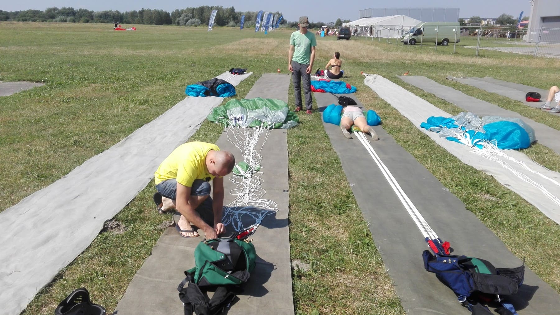 People arranging parachutes on packing mats in Gliwice Poland in2017