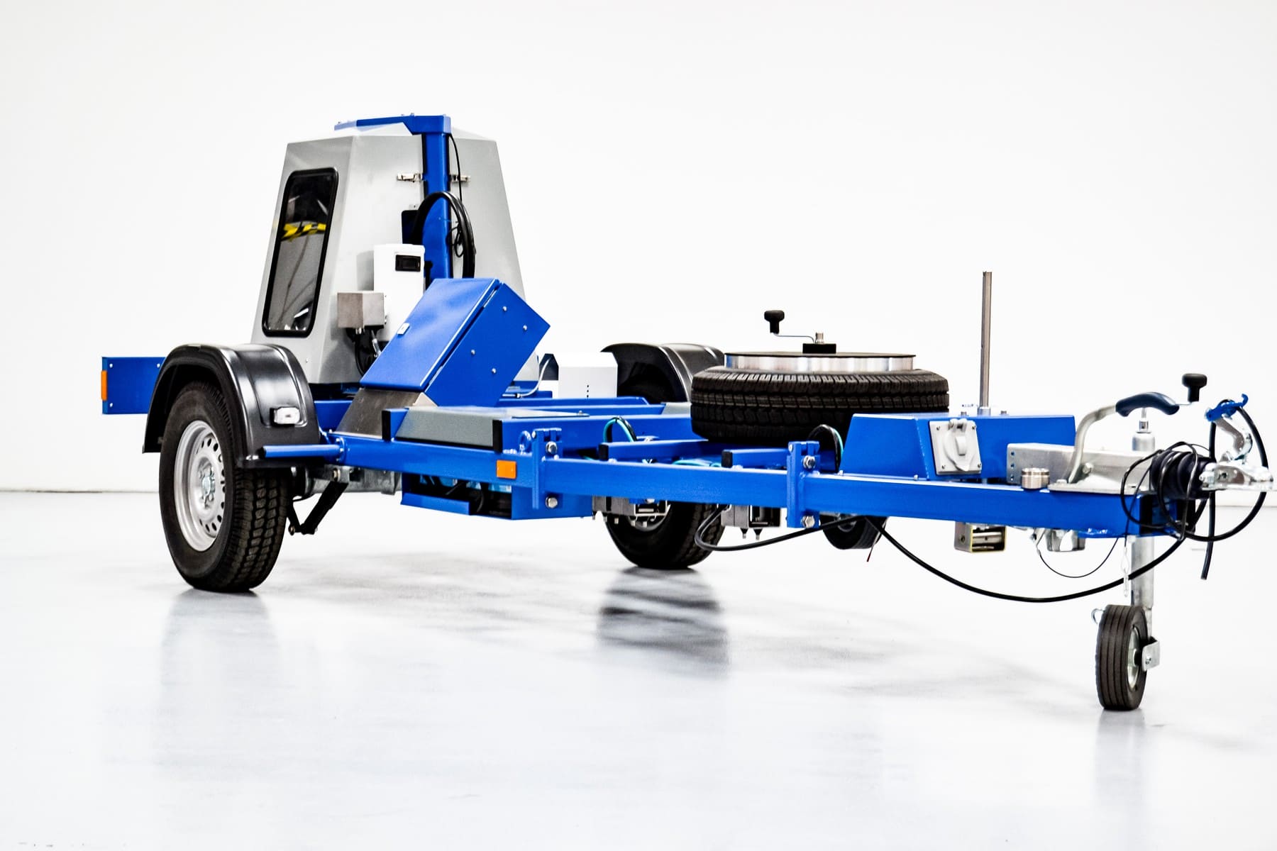 Blue trailer mounted falling weight deflectometer pavement testing equipment