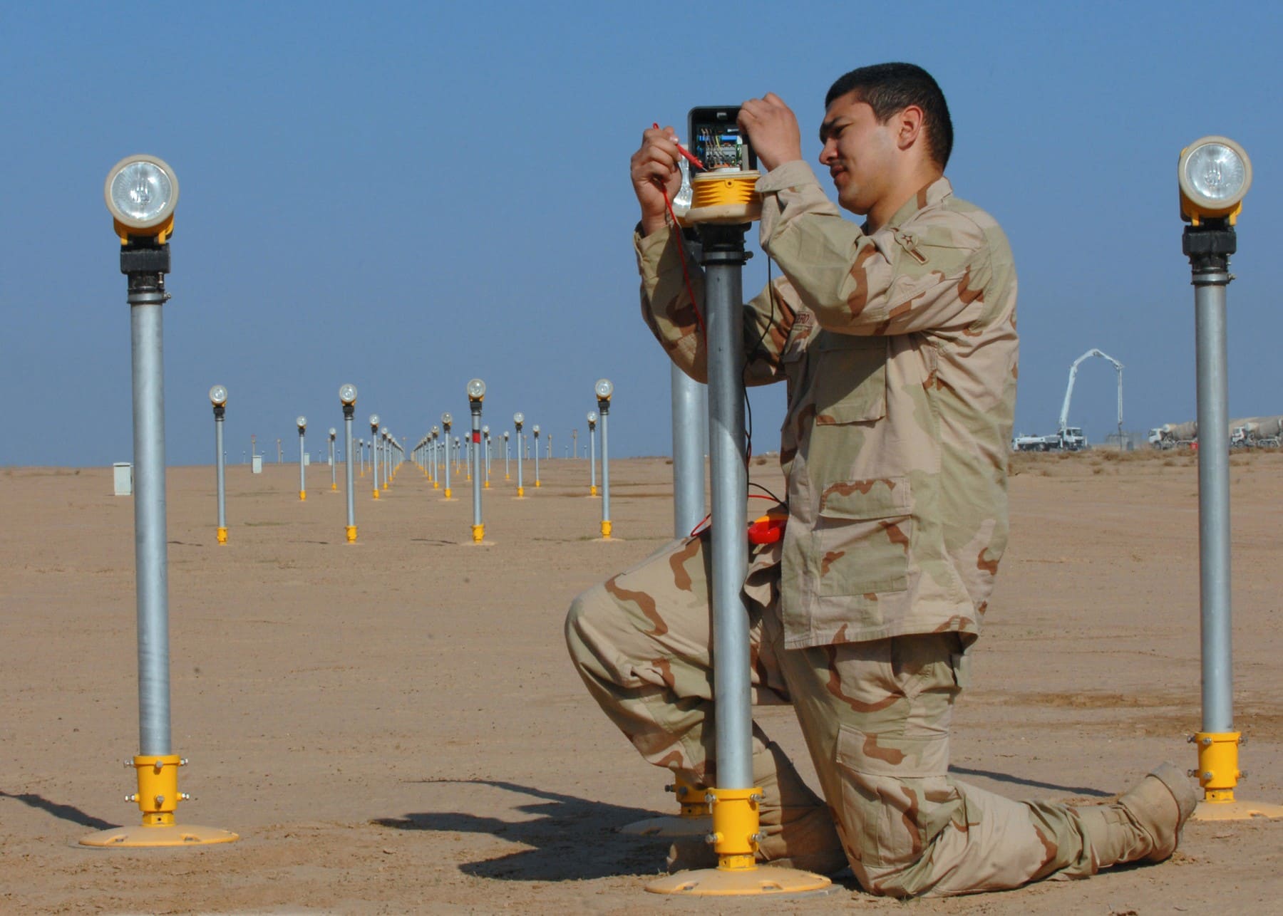 US Air Force electrician working on an approach lighting fixture at Balad in 2008