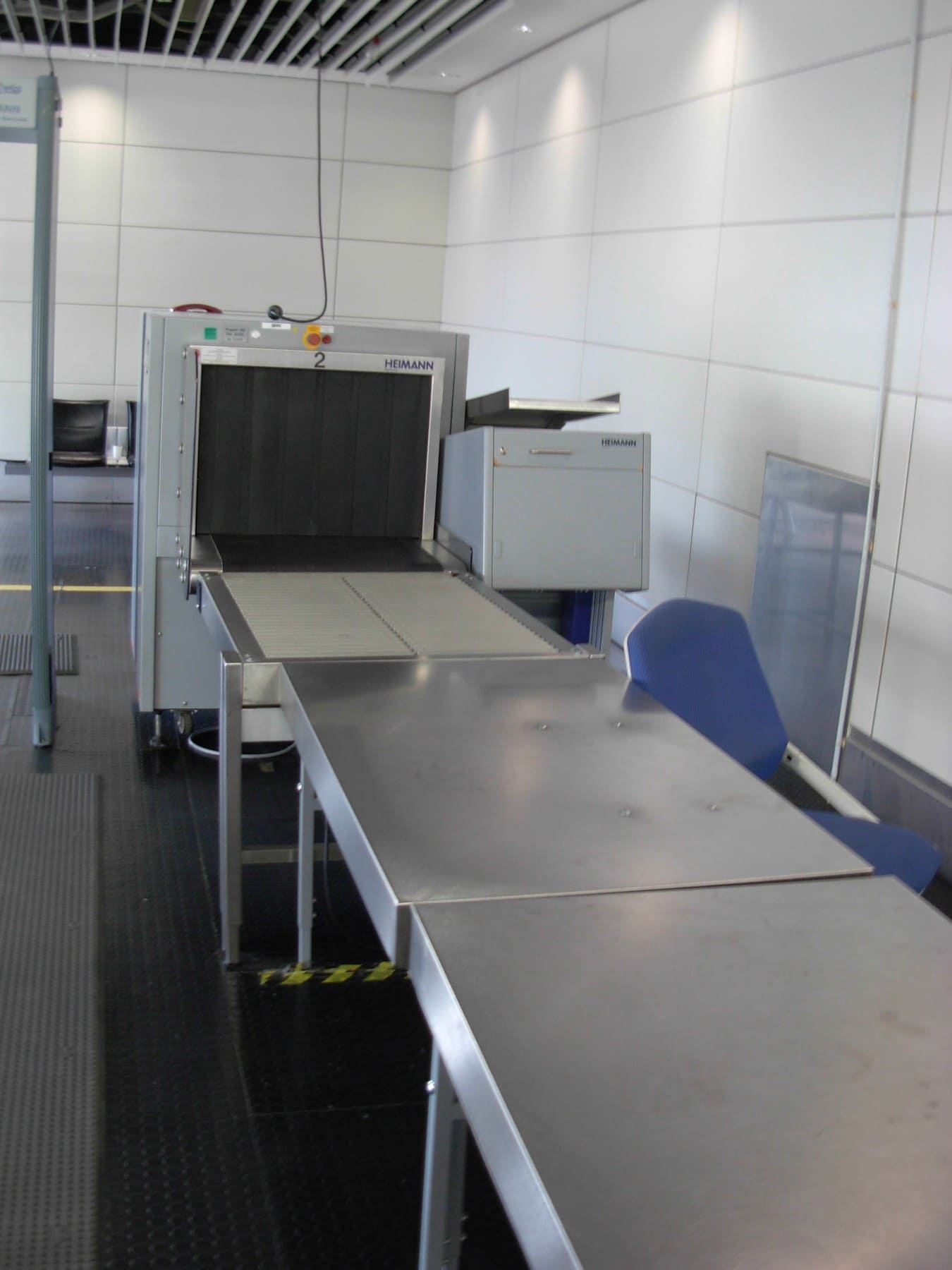 Historical airport security machine with conveyor photographed in 2007