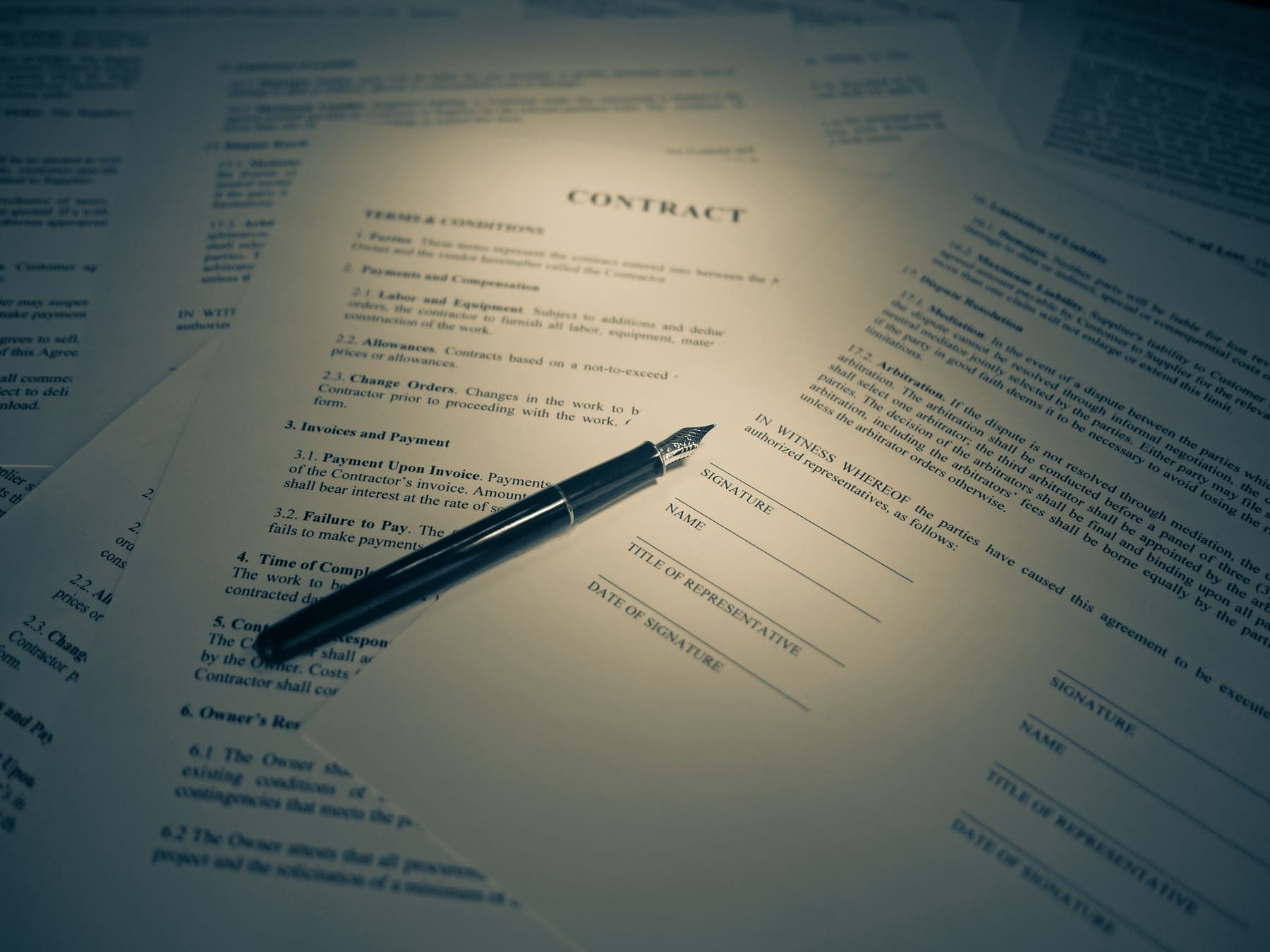 Generic unsigned contract paperwork and fountain pen photographed in2016