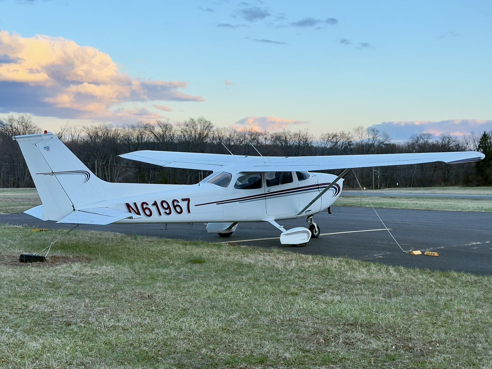 Cessna 172 Skyhawk parked beside an airport apron