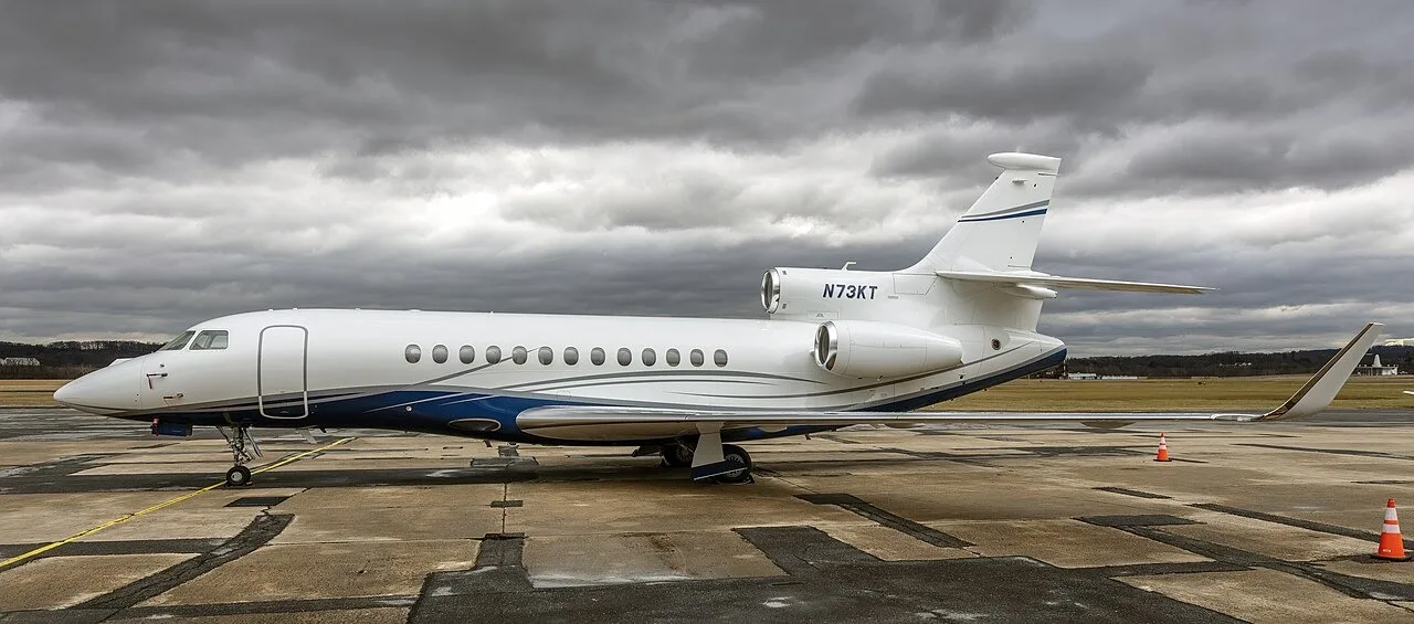 Dassault Falcon 7X N73KT parked on an airport apron